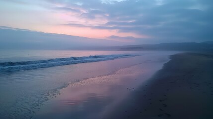 Fototapeta premium As dawn breaks, the beach is bathed in soft light, and the sea sparkles with the first rays of the sun. The calm and quiet morning is perfect for meditation and morning jogs along the shore.