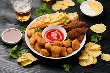 Chicken nuggets, Southern strips, Chicken fingers, french fries, chips, various sauces and beer