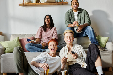 Diverse group of people sitting together on a couch.