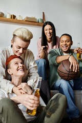 Diverse friends sitting on a couch, holding a basketball, spending time together.