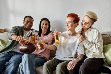 A diverse group of friends and a loving lesbian couple sit together atop a cozy couch.