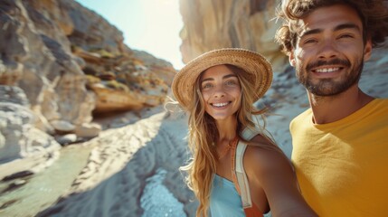 A happy couple takes a selfie with a wide smile while surrounded by impressive rocky landscape under a clear sky - Powered by Adobe