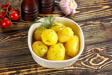 Boiled potato with oil and dill