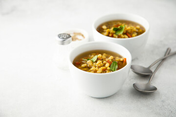 Healthy lentil soup with basil