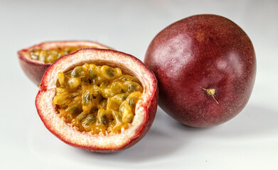 Passion fruit on a light background. Ripe passion fruit. Exotic fruit background.
