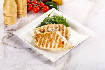 Grilled chicken breast served arugula