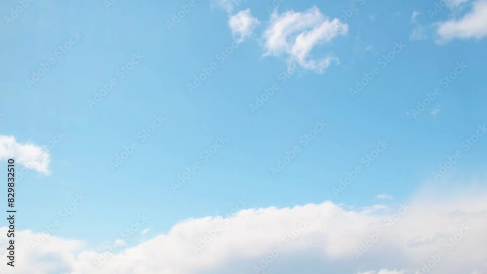 Wall mural summer sky with white, cumulus clouds. background with empty space for titles. clouds frame copy spa