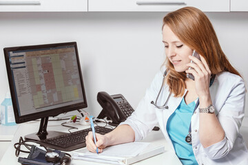 Patient visiting his doctor at hospital. Doctor woman at work in hospital excited and happy of...