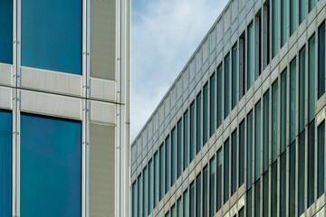 Neatly arranged exterior windows of modern buildings.