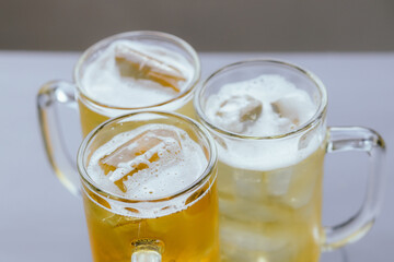 Close-up cropped photos of friends Clinking beer glasses