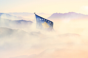 Kosovo flag disappears in beautiful clouds with fog.