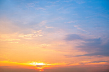 Fototapeta premium Beautiful , luxury soft gradient orange gold clouds and sunlight on the blue sky perfect for the background, take in everning,Twilight, Large size, high definition landscape photo