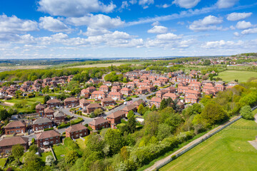 Aerial photo of the town of Kippax in Leeds West Yorkshire in the UK showing residential housing...