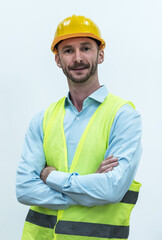 Portrait young Caucasian engineer man with safety helmet and vest on white background