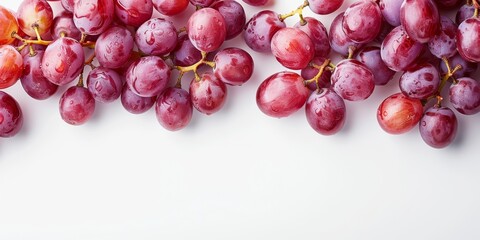 Fototapeta premium Whole and sliced grapes arranged neatly, isolated on white background, great for healthy food promotions, bright and inviting, ample space for text