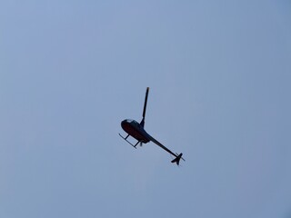 Helicopter flying in sky under the beach 'Platja el Palmeral',
near the Aeroclub de Castelló, El Grao de Castellón, Valencia, Mediterranian cost of Spain