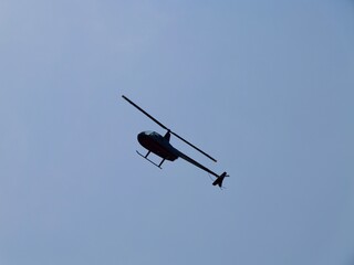 Helicopter flying in sky under the beach 'Platja el Palmeral',
near the Aeroclub de Castelló, El Grao de Castellón, Valencia, Mediterranian cost of Spain