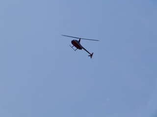 Helicopter flying in sky under the beach 'Platja el Palmeral',
near the Aeroclub de Castelló, El Grao de Castellón, Valencia, Mediterranian cost of Spain