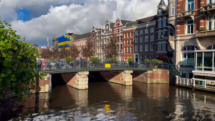 Amsterdam autumn cityscape narrow old houses, canals, boats Amsterdam, Netherlands September 20, 2023