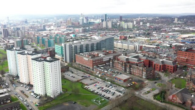 Aerial footage taken of the St James's University Hospital, A&E department and Thackray Medical Museum located in the town of Harehills in Leeds West Yorkshire in the UK along side apartment blocks.