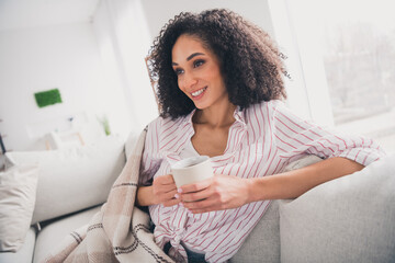 Photo of dreamy sweet lady wear white shirt smiling drinking tasty beverage indoors room home house