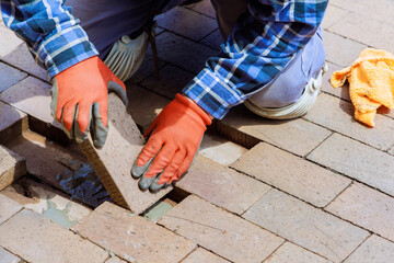 It is replacement of broken brick path in pavement that is being rebuilt