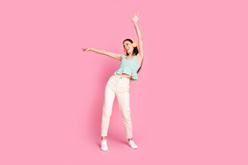 Photo of cool funny glad woman wear trendy clothes have fun good mood isolated on pink color background