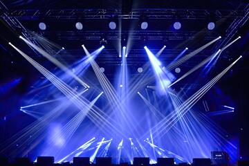 a stage with blue lights and a crowd, Concert stage lighting effects created with color gels