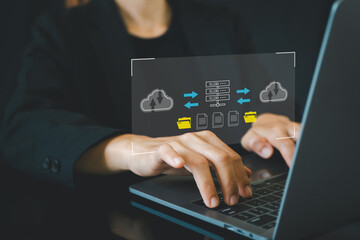 Businesswoman use laptop to download organizational information or documents. cloud storage technology, backup cyber security system.