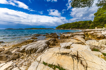 Landscape of the Croatian coast around Rovinj, rocky beaches, azure Adriatic Sea