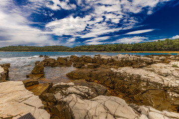 Landscape of the Croatian coast around Rovinj, rocky beaches, azure Adriatic Sea