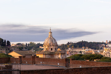 Rome, Italy - April 09, 2024: View of the streets at sunrise in Rome with tourists crowding its surroundings in Rome, Italy