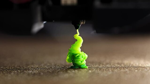 3D Printer Nozzle Cleaning Process, Printing With Green Filament, close up view