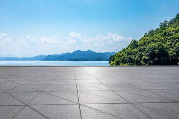 Empty square floor and lake with green island nature landscape in summer