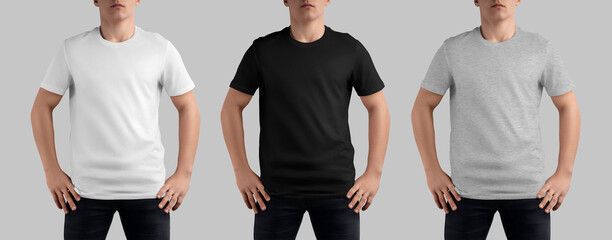 Mockup of a white, black, heather t-shirt on a teenager in dark jeans, with hands on his waist,...