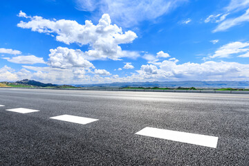 Asphalt highway road and green mountain with sky clouds nature landscape under blue sky