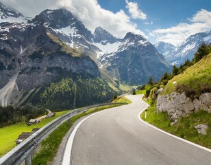 Naklejka premium transport road in the Alps against the backdrop of snow-capped mountains and forest