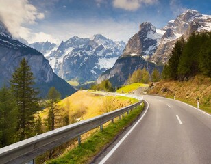 Naklejka premium transport road in the Alps against the backdrop of snow-capped mountains and forest