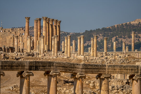 Ancient Ruins of Gerash, Jordan: Majestic Roman Columns with Artemis Temple in the Background