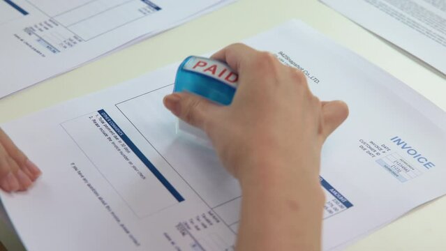 Worker busy work seal getting paying symbol on sales bill form report paper stack. Pay off full amount income tax fee past due date sale office job task. Cash flow debt credit loan risk control budget