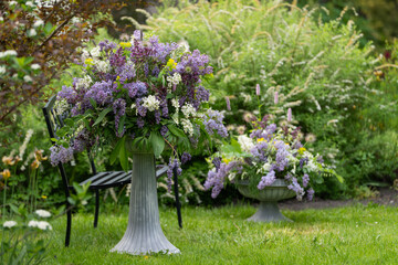 Luxurious bouquet of white, light and deep violet lilac in a vintage vase. Art photography nature, flowers, still life for wall pictures and wall posters