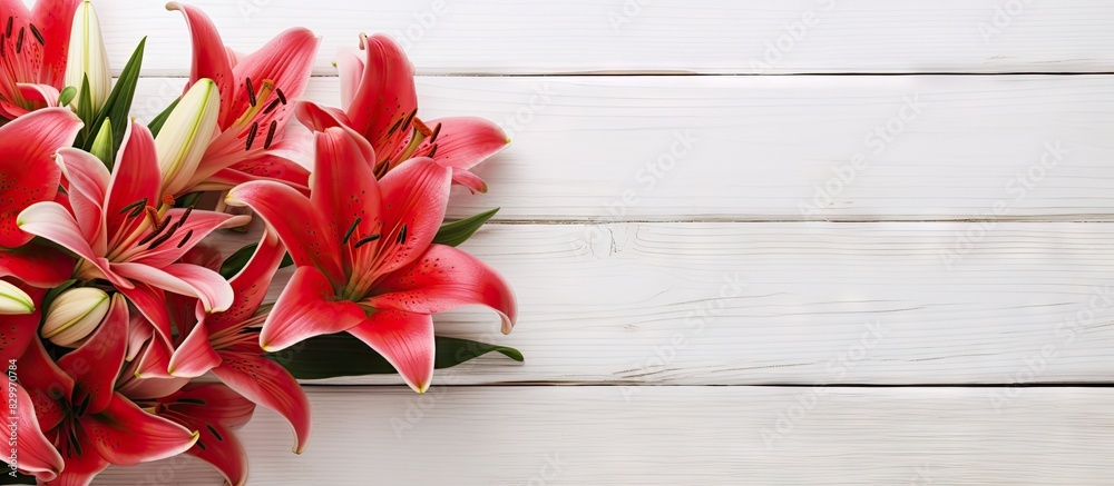 Aufkleber a bouquet of lily flowers adorned with a red ribbon displayed on a white wooden background providing