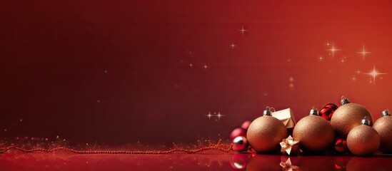 A festive red background with Christmas decorations like a fir tree wrapped presents cones berries and sparkly red balls There s room for text in this image. with copy space image