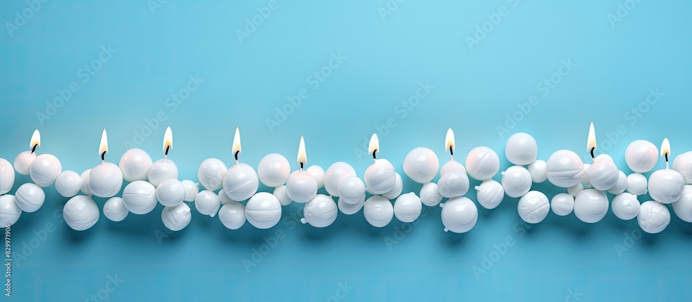 Aufkleber blue background with copy space image of a birthday greeting card adorned with marshmallows and bead