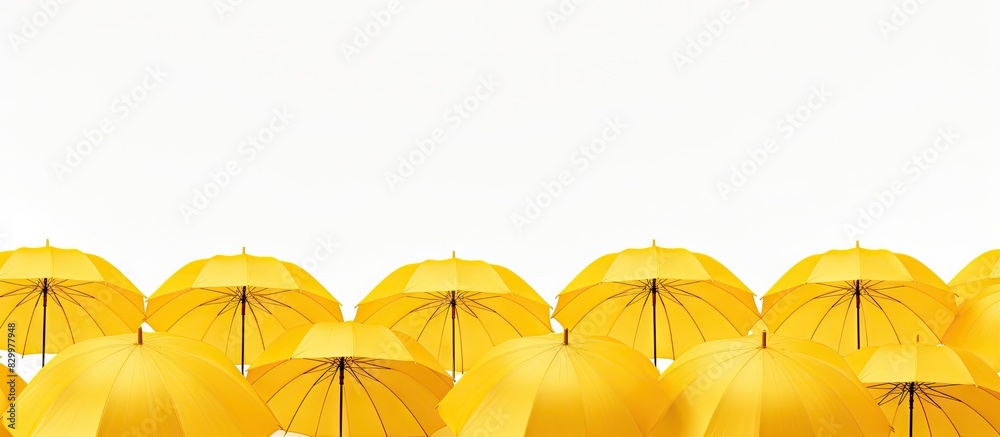 Poster a copy space image featuring yellow umbrellas set against a white background