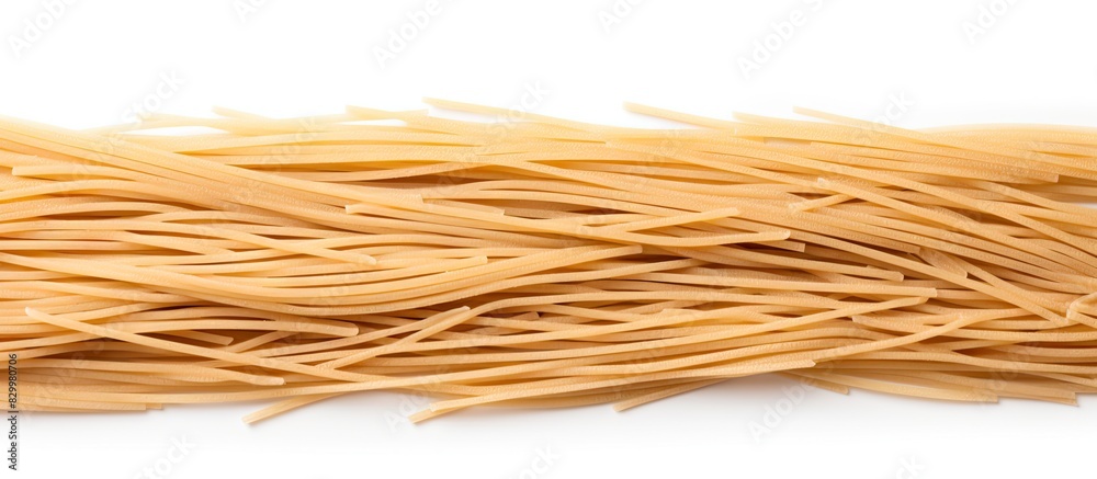 Poster Close up of durum wheat spaghetti on isolated white background providing ample copy space for text