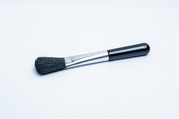 Small black brush isolated on white background
