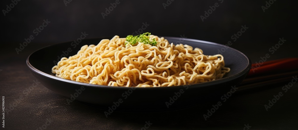 Poster A close up image of uncooked instant noodles placed on a gray plate providing ample space for text or captions