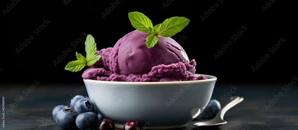 Poster a dairy free dessert consisting of a refreshing and nutritious homemade huckleberry ice cream adorne