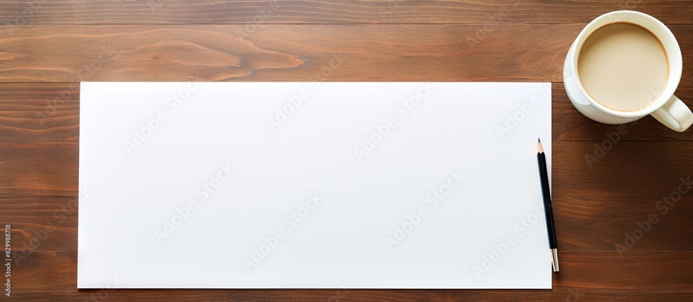 Poster Top view of a blank paper and pen on a desk with empty space for text or image. with copy space image. Place for adding text or design